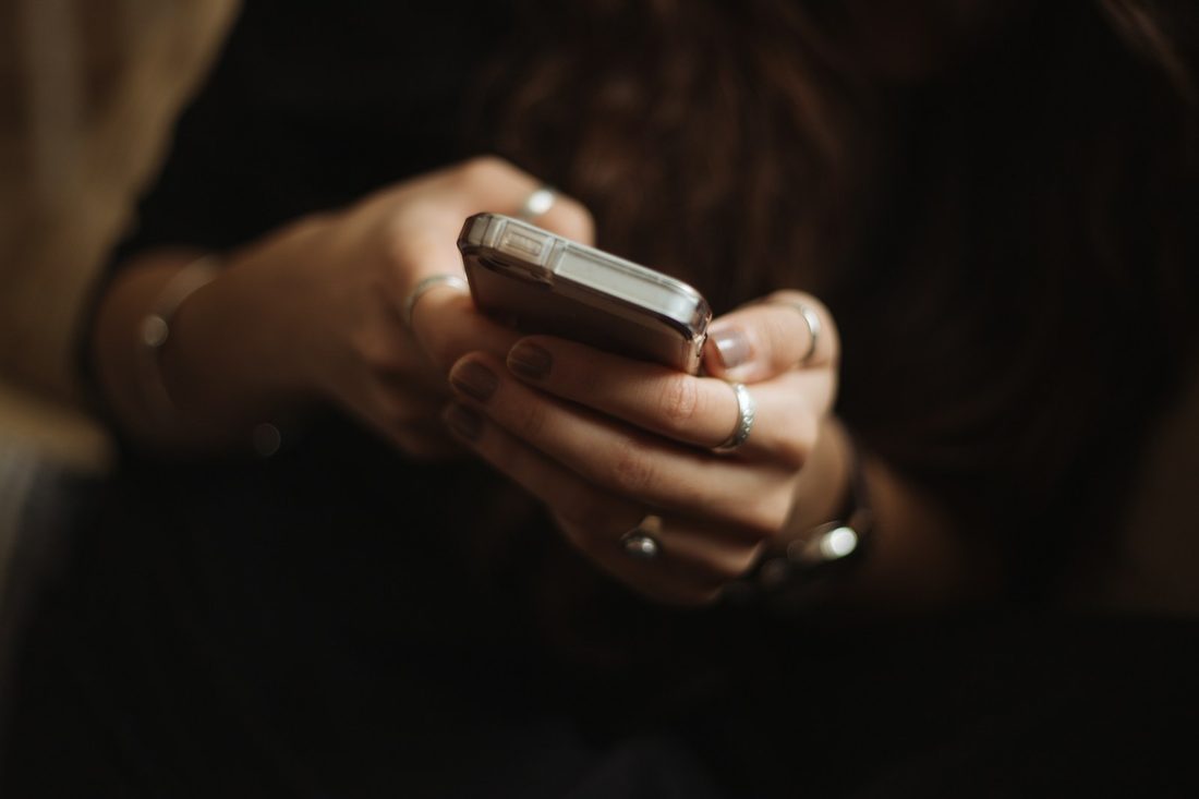 A person reading a text message on their phone